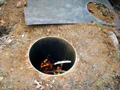 Survival skills smoking meat in the ground