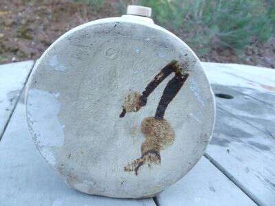 Bottom of round pottery piece with a cork